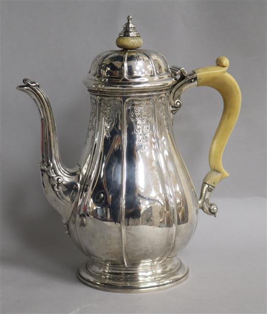 A George V silver coffee pot, retailed by Asprey, London, Adie Bros, Birmingham, 1934, gross 22.5 oz.